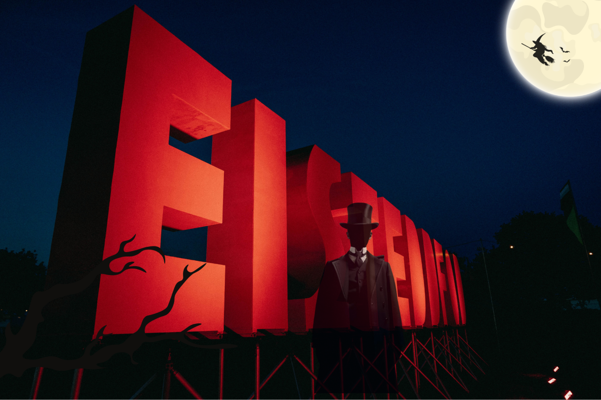 Eisteddfod sign with a ghostly figure in front of it | Arwydd yr Eisteddfod gyda ffigwr ysbrydol o'i flaen