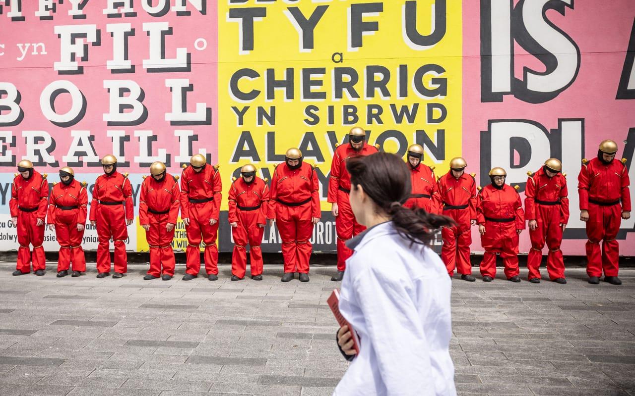 Image: Hijinx's playful participatory street theatre show Enter the Robots. The robots lined up ready for action.